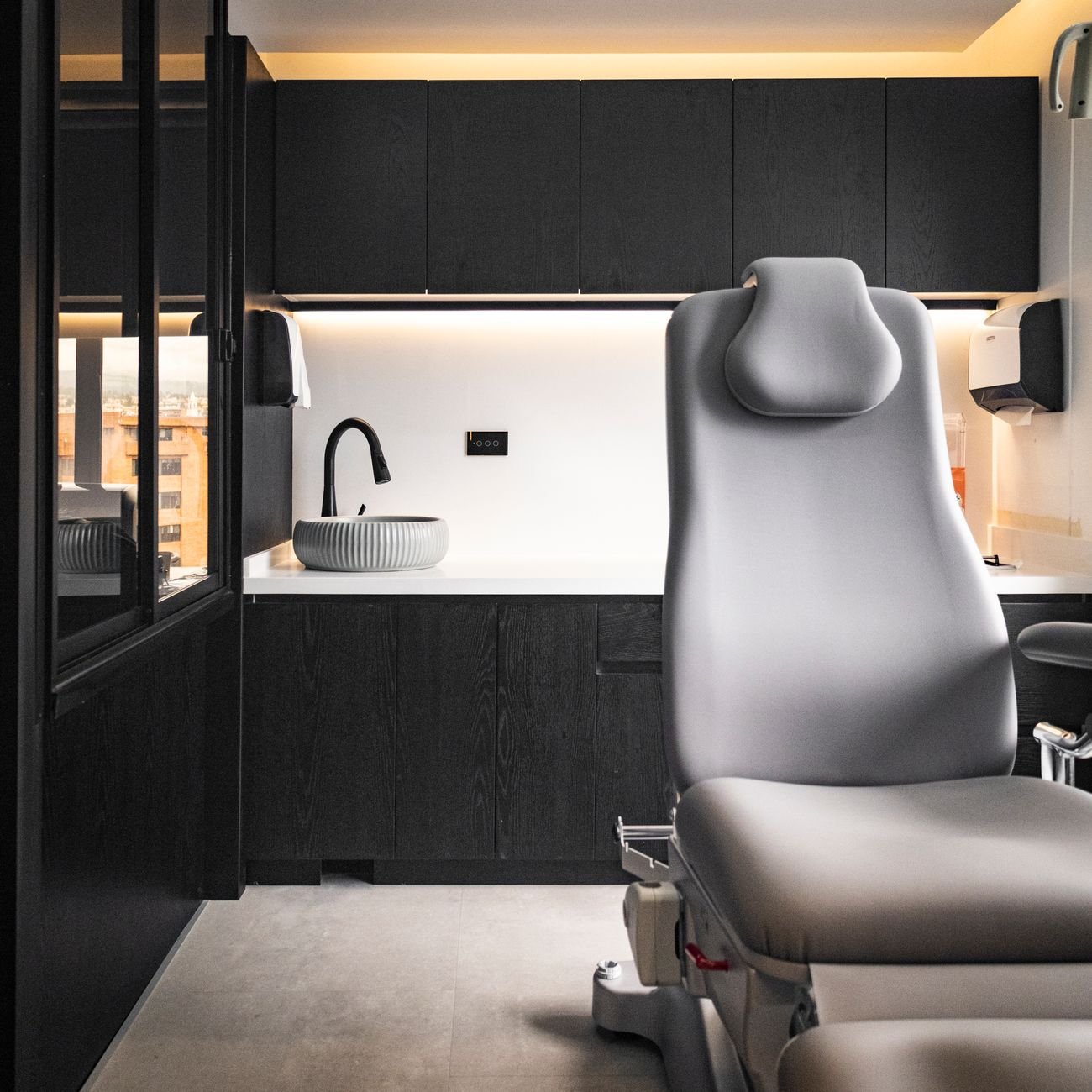 Sleek and modern dental office interior with ergonomic dental chair.